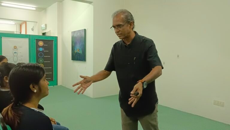 Facilitator engaging directly with a participant during the workshop