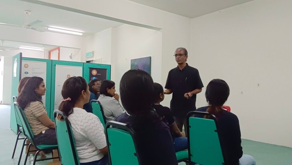 Participants attentively listening to the facilitator at the Women Empowerment Workshop